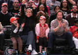 Tea Leoni and husband David Duchovny with their children at the New York Knicks game in New York City, NY